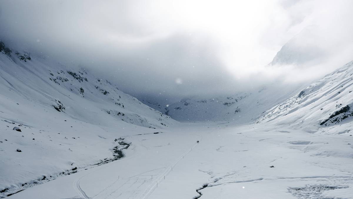 A breathtaking view of a snowy mountain ridge covered with soft white powder